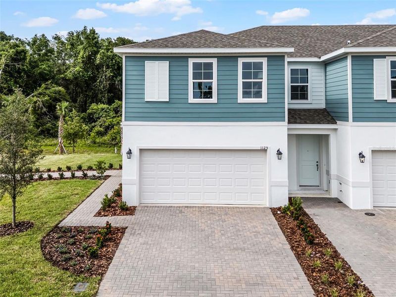 Front exterior of a new home in Delaney Reserve, Deland, FL, highlighting curb appeal (Image 21).