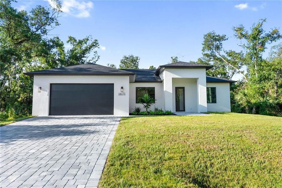 Front exterior of a new home in , Port Charlotte, FL, highlighting curb appeal (Image 31).