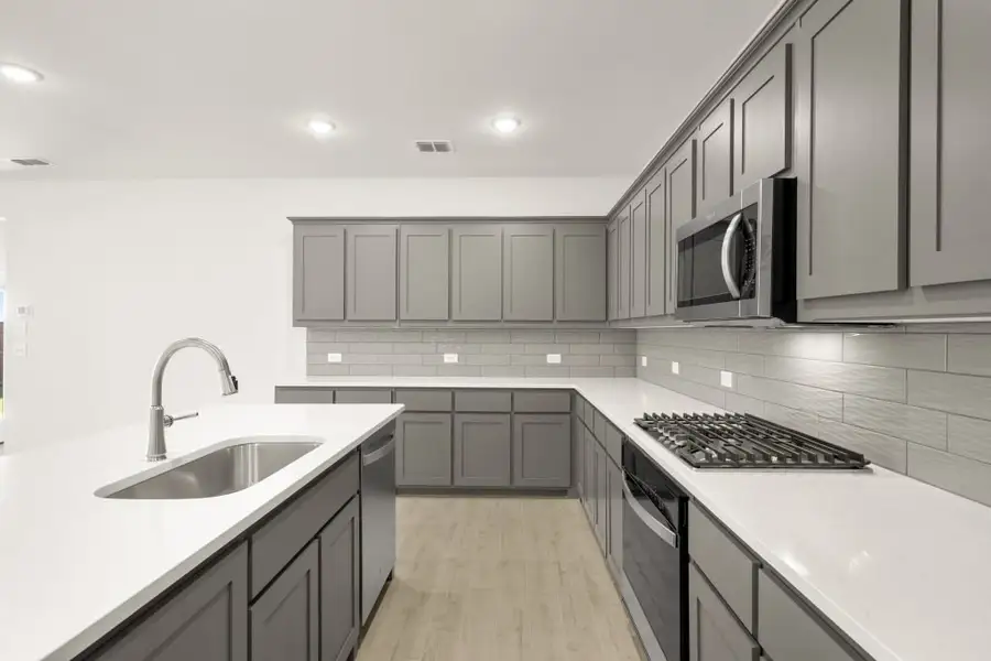 Front exterior of a new home in Myrtle Creek, Waxahachie, TX, highlighting curb appeal (Image 8). Front exterior of a new home in Myrtle Creek, Waxahachie, TX, highlighting curb appeal (Image 8).