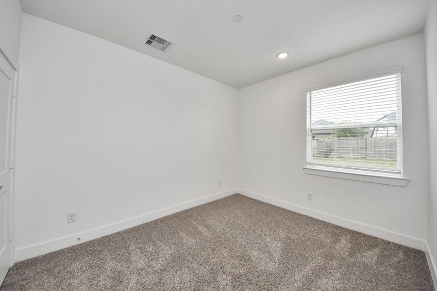 Spacious, unfurnished interior of a new home in Meridiana Courtyard Collection, Manvel (Image 23).