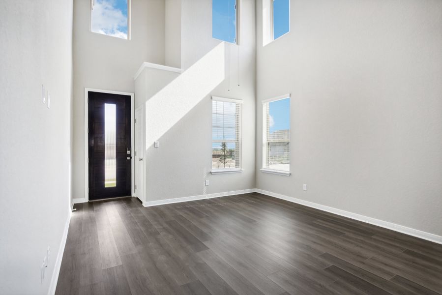 Entry and living room the Medina floorplan at a Meritage Homes community.