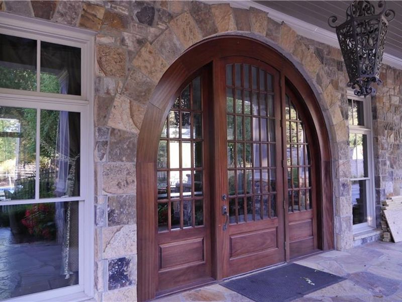 Exterior details and patio area of a home in The Village at Towne Lake, Woodstock (Image 32).