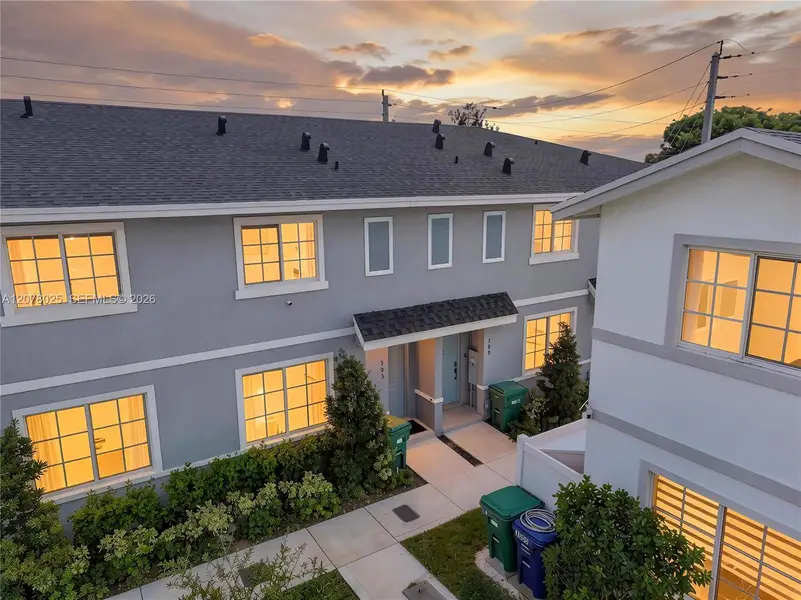 Front exterior of a new home in , Florida City, FL, highlighting curb appeal (Image 1). Front exterior of a new home in , Florida City, FL, highlighting curb appeal (Image 1).