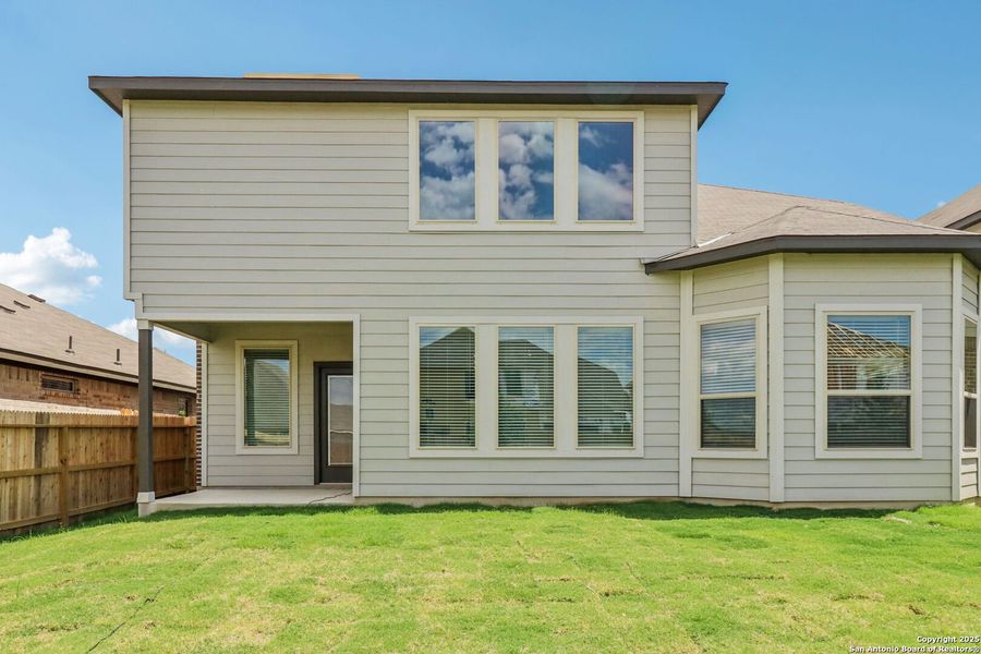 Front exterior of a new home in Fox Falls, Boerne, TX, highlighting curb appeal (Image 1).