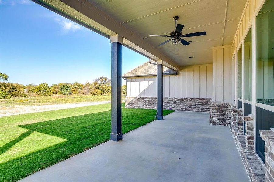 View of patio featuring ceiling fan