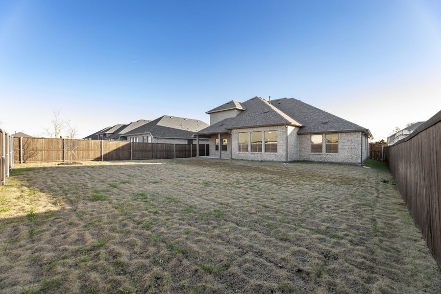 Exterior details and patio area of a home in Meadow Run, Melissa (Image 17).