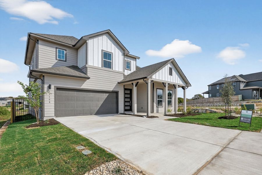 Front exterior of a new home in Whisper Valley, Manor, TX, highlighting curb appeal (Image 20).