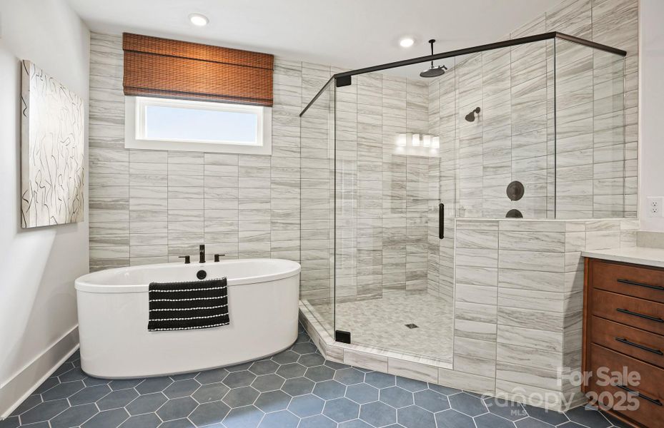 Primary Bath Complete with Oversized Shower and Free Standing Tub.  Representative Photo
