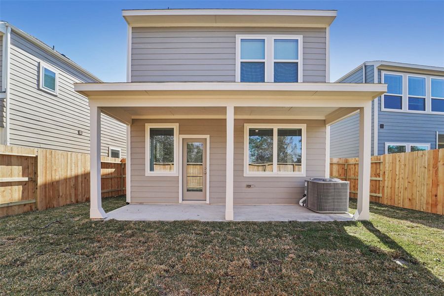 Exterior details and patio area of a home in Pinewood Trails - City Series, Atascocita (Image 22).