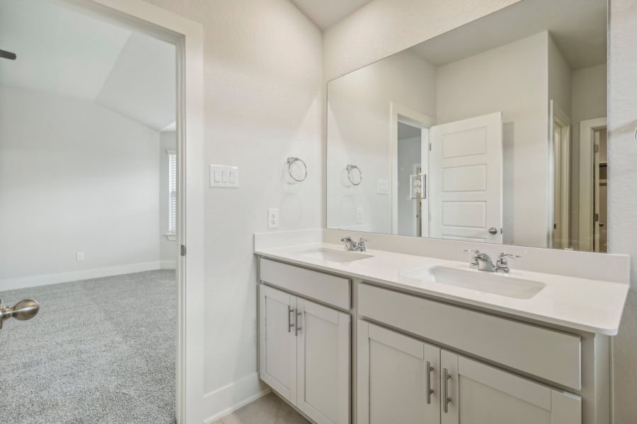 Primary suite bathroom in the Hughes floorplan at a Meritage Homes community.