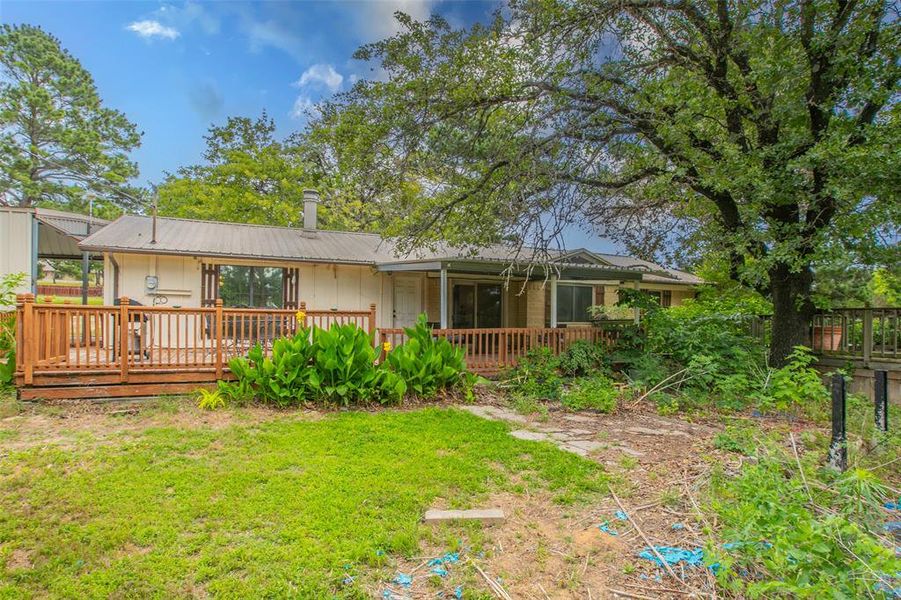 Large covered deck overlooking the backyard and gardens, creating the perfect space for relaxing or entertaining. Large covered deck overlooking the backyard and gardens, creating the perfect space for relaxing or entertaining.