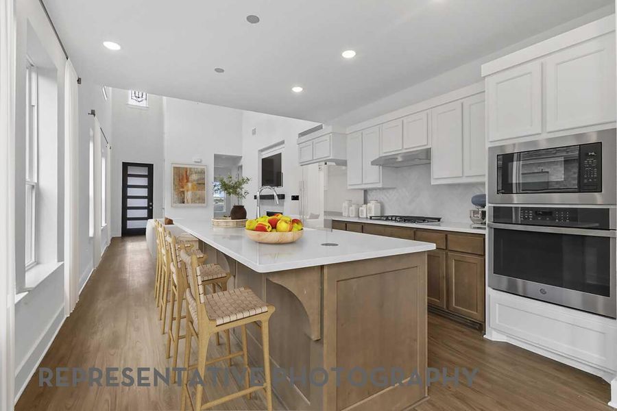 The kitchen opens seamlessly to the family room and dining area, creating a bright, connected space perfect for cooking, entertaining, and gathering with loved ones.