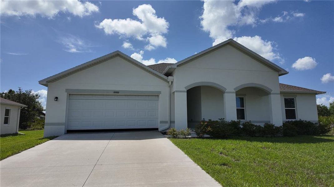 Front exterior of a new home in South Gulf Cove, Port Charlotte, FL, highlighting curb appeal (Image 1). Front exterior of a new home in South Gulf Cove, Port Charlotte, FL, highlighting curb appeal (Image 1).