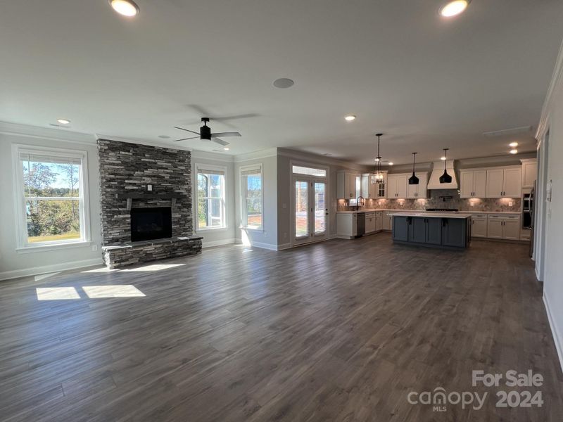 Open Living Space with Full Wall Stone Fireplace