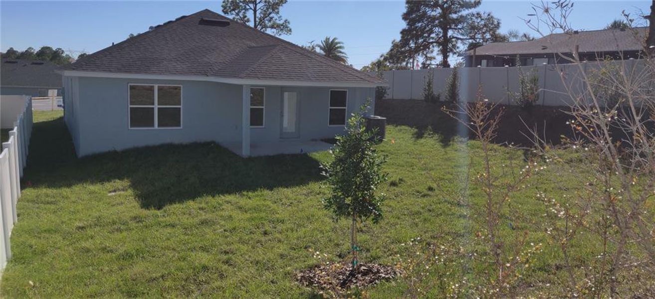 Exterior details and patio area of a home in Sunset Landing, Spring Hill (Image 2).