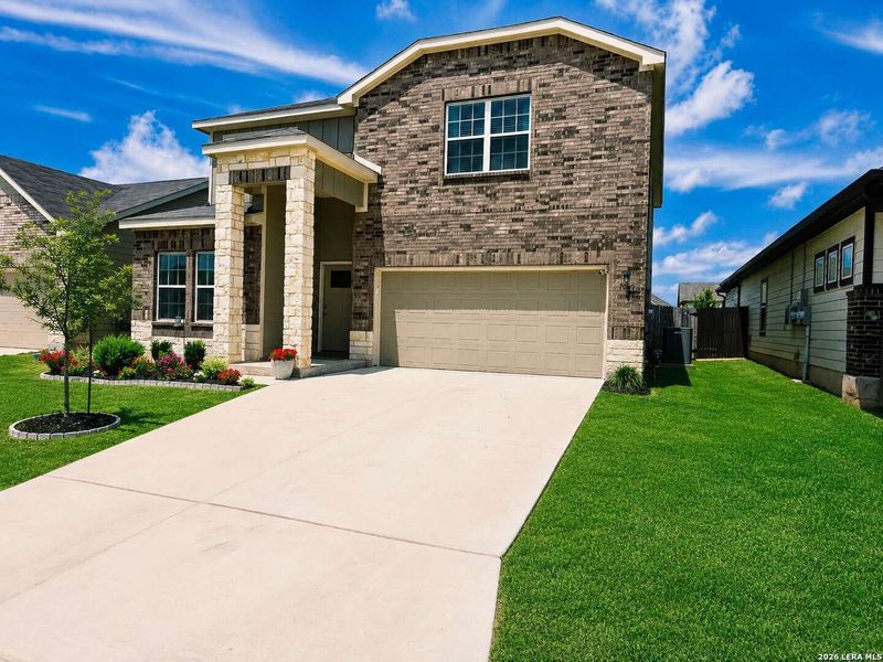 Front exterior of a new home in Hennersby Hollow, San Antonio, TX, highlighting curb appeal (Image 2). Front exterior of a new home in Hennersby Hollow, San Antonio, TX, highlighting curb appeal (Image 2).