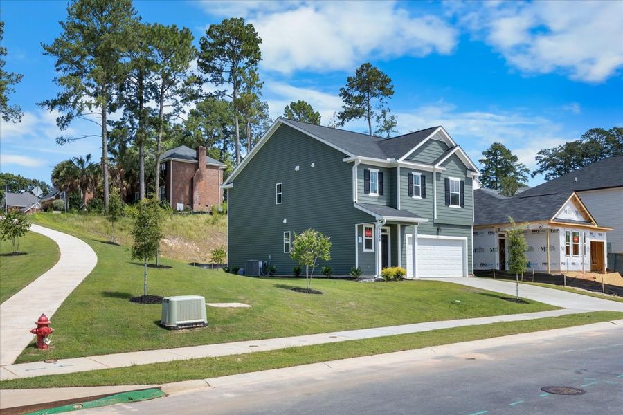Front exterior of a new home in Forrest Bluff, North Augusta, SC, highlighting curb appeal (Image 18). Front exterior of a new home in Forrest Bluff, North Augusta, SC, highlighting curb appeal (Image 18).