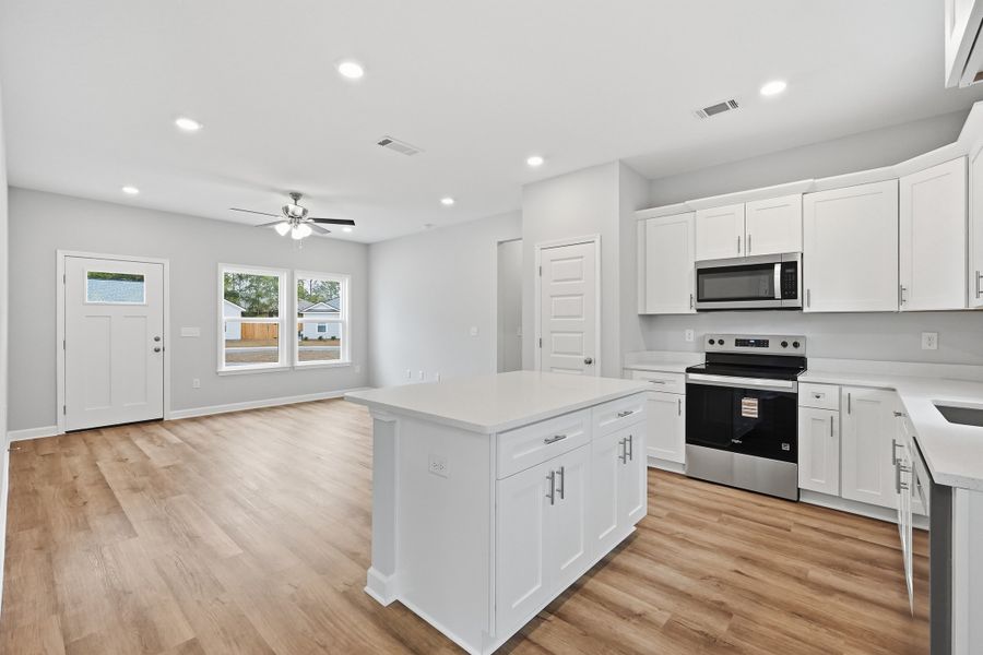 Furnished interior view inside a new home in Live Oak Cottages, Freeport (Image 6).