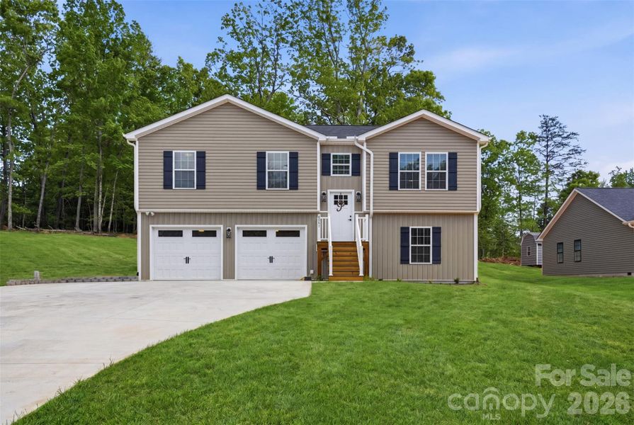 Front exterior of a new home in , Granite Falls, NC, highlighting curb appeal (Image 22).