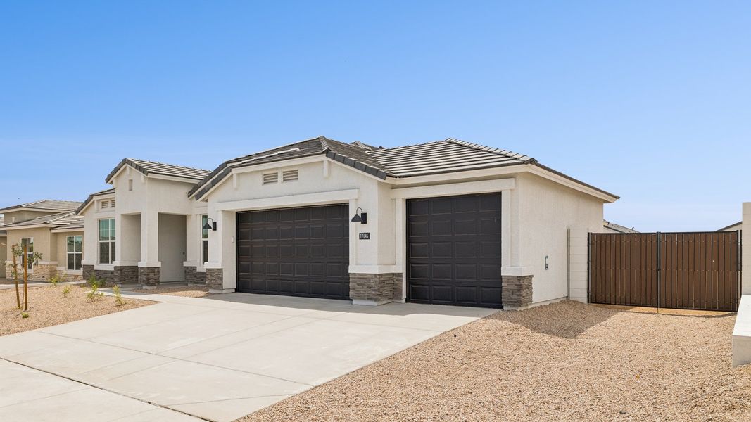 Front exterior of a new home in Zanjero Pass, Waddell, AZ, highlighting curb appeal (Image 25).