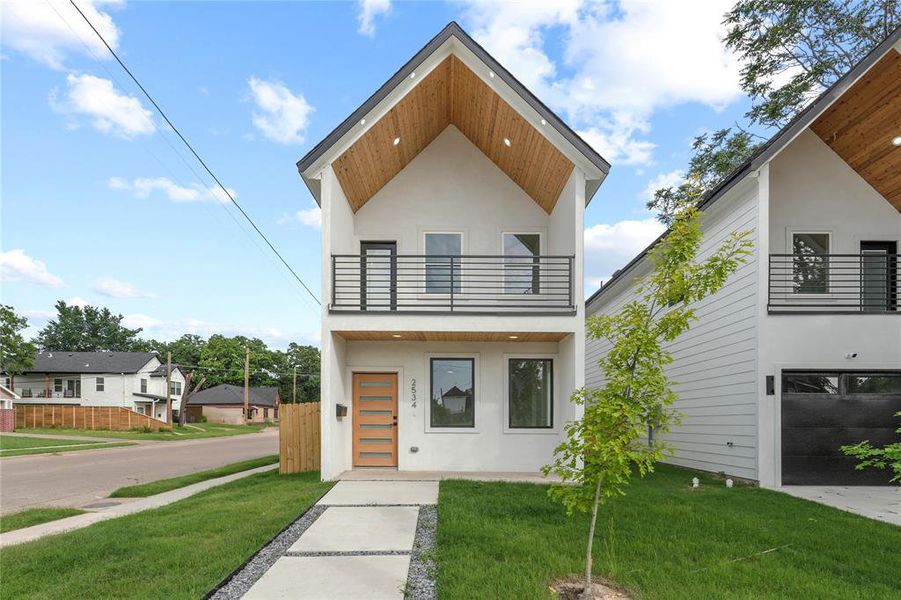 Contemporary house with a balcony and stucco siding Contemporary house with a balcony and stucco siding