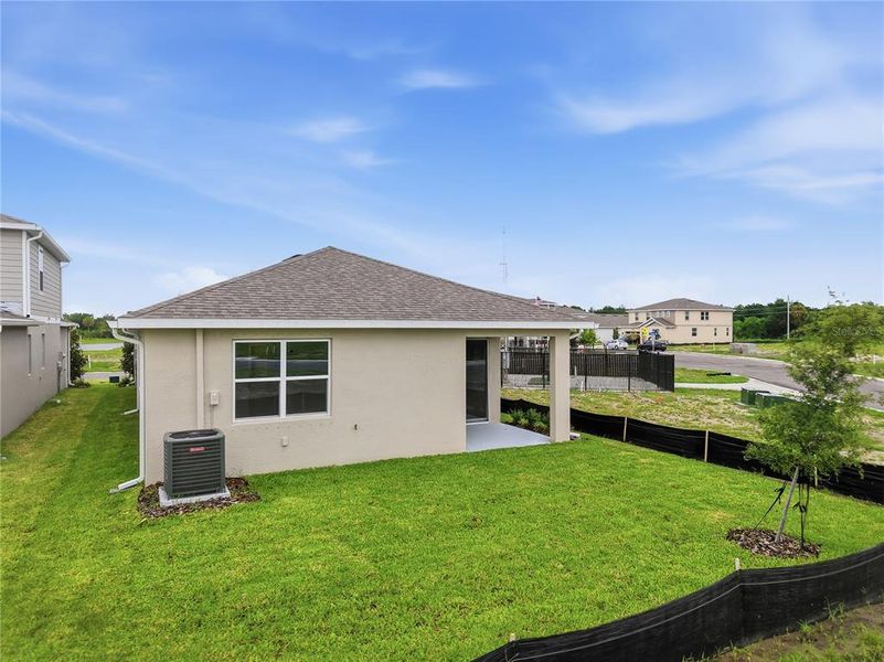 Exterior details and patio area of a home in Estates at Rivers Edge, Parrish (Image 29).
