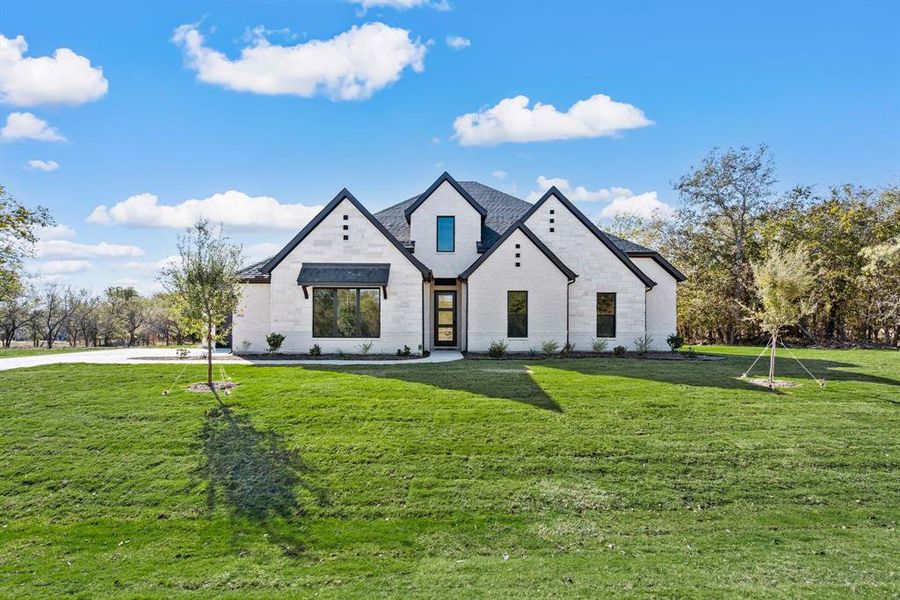 Front exterior of a new home in Rolling Creek Ranch, Aledo, TX, highlighting curb appeal (Image 23). Front exterior of a new home in Rolling Creek Ranch, Aledo, TX, highlighting curb appeal (Image 23).