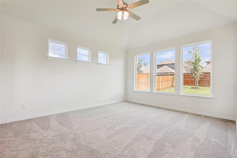 Empty room with carpet and ceiling fan