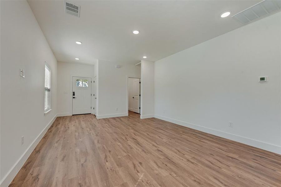 Foyer with recessed lighting and light wood-type flooring Foyer with recessed lighting and light wood-type flooring