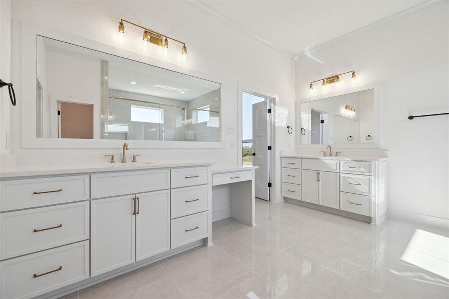 Bathroom featuring vanity and a shower with shower door