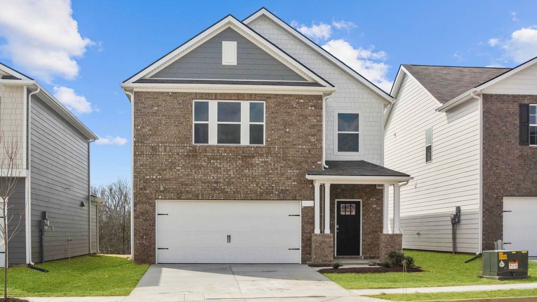 Front exterior of a new home in River Landing, Murfreesboro, TN, highlighting curb appeal (Image 1). Front exterior of a new home in River Landing, Murfreesboro, TN, highlighting curb appeal (Image 1).