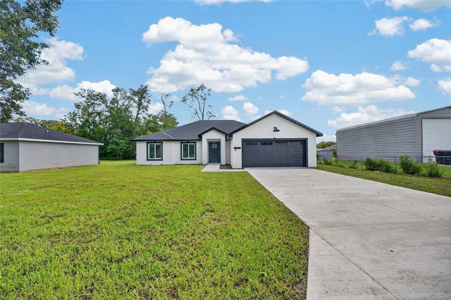 Front exterior of a new home in , Summerfield, FL, highlighting curb appeal (Image 23). Front exterior of a new home in , Summerfield, FL, highlighting curb appeal (Image 23).