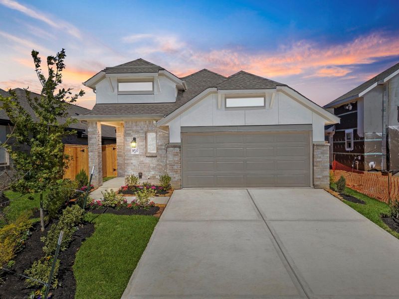 Front exterior of a new home in Grand Central Park, Conroe, TX, highlighting curb appeal (Image 20). Front exterior of a new home in Grand Central Park, Conroe, TX, highlighting curb appeal (Image 20).