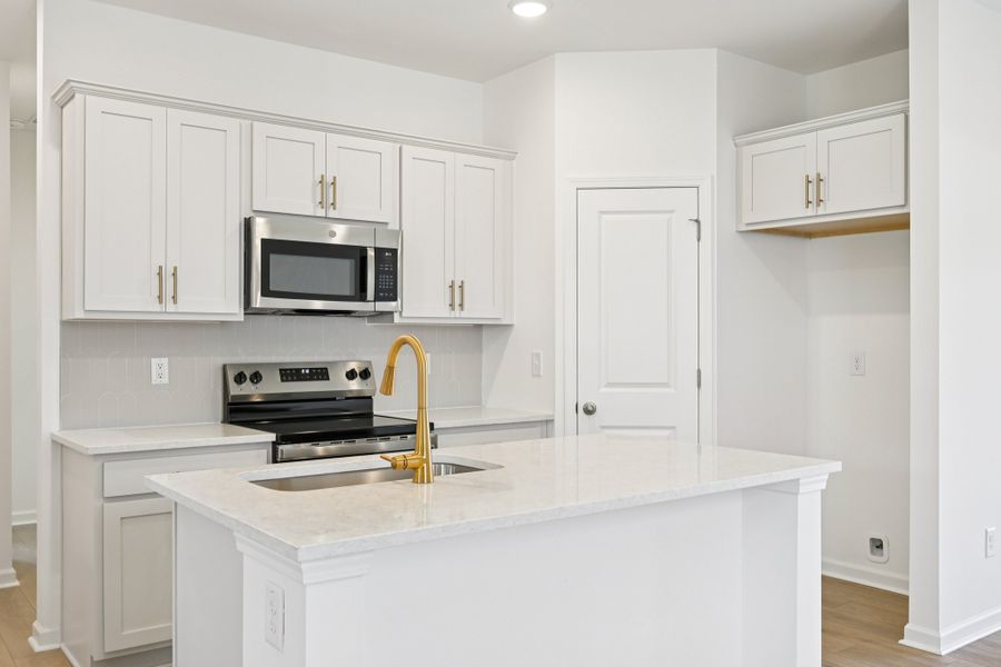 Representative furnished interior of a home built from the Grove by Ashton Woods in Middleton Farms, Middlesex (Image 5).