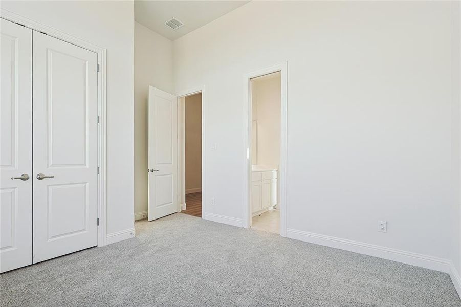 Bathroom with vanity and light colored carpet Bathroom with vanity and light colored carpet
