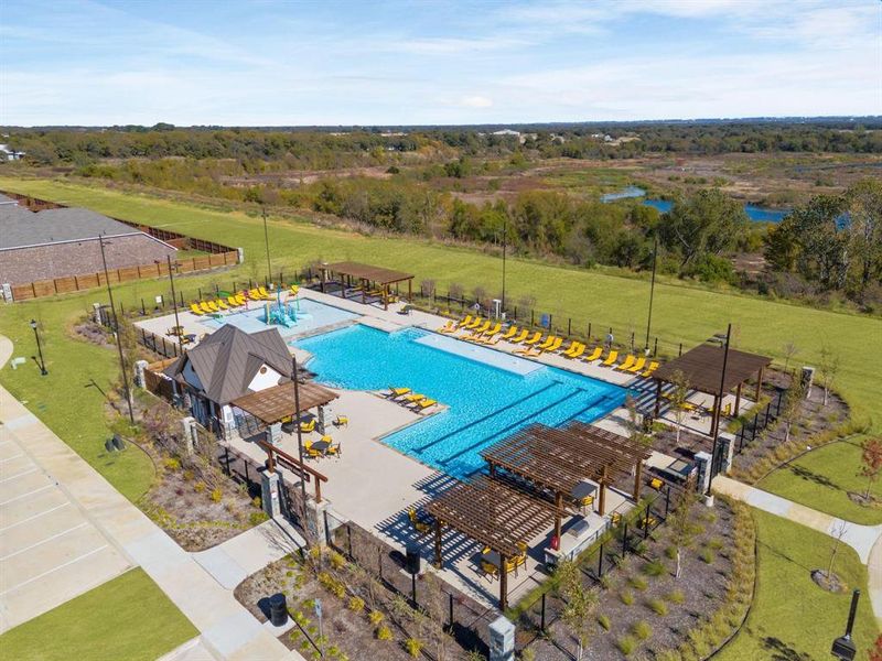 Community pool with a patio