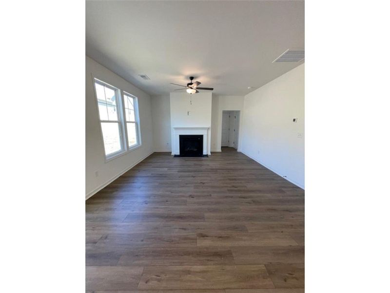 This expansive living area features elegant floori