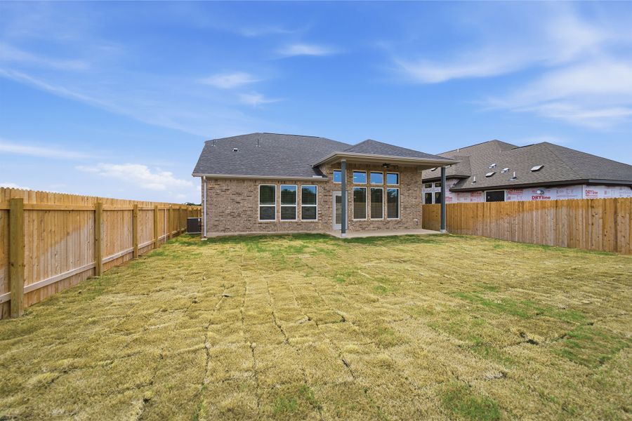 Exterior details and patio area of a home in Santa Rita Ranch, Liberty Hill (Image 27).