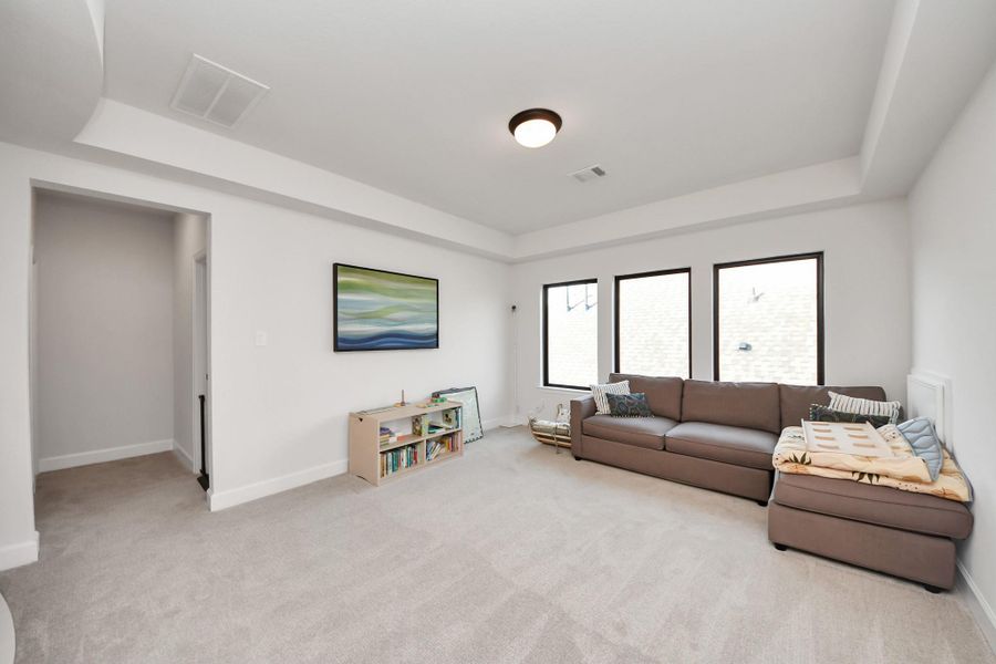 Spacious upstairs living area with flexible use options.