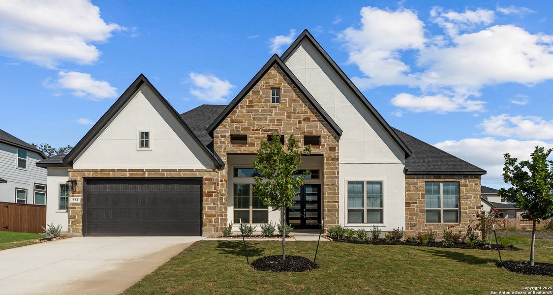 Front exterior of a new home in Mesa Western, Cibolo, TX, highlighting curb appeal (Image 25). Front exterior of a new home in Mesa Western, Cibolo, TX, highlighting curb appeal (Image 25).
