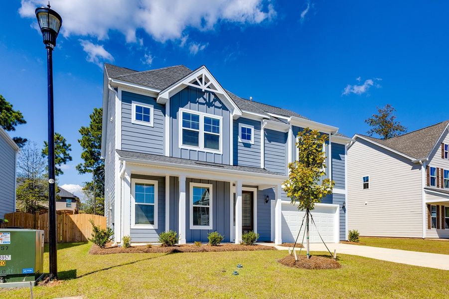 Front exterior of a new home in Pebble Branch, Chapin, SC, highlighting curb appeal (Image 2). Front exterior of a new home in Pebble Branch, Chapin, SC, highlighting curb appeal (Image 2).