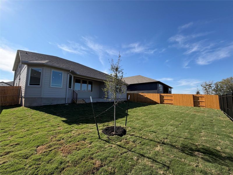 Back of house featuring a fenced backyard