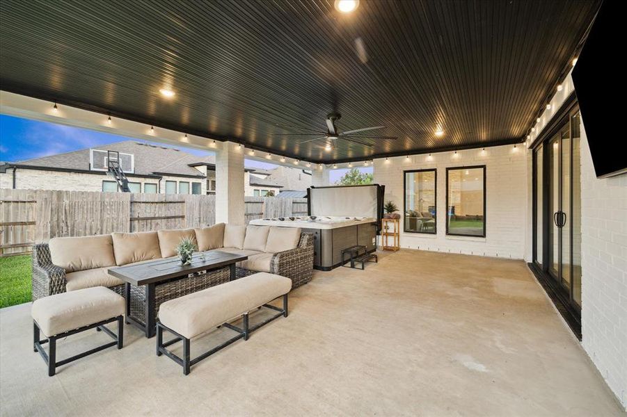 This widened extended covered patio offers plenty of room for all your backyard gatherings.