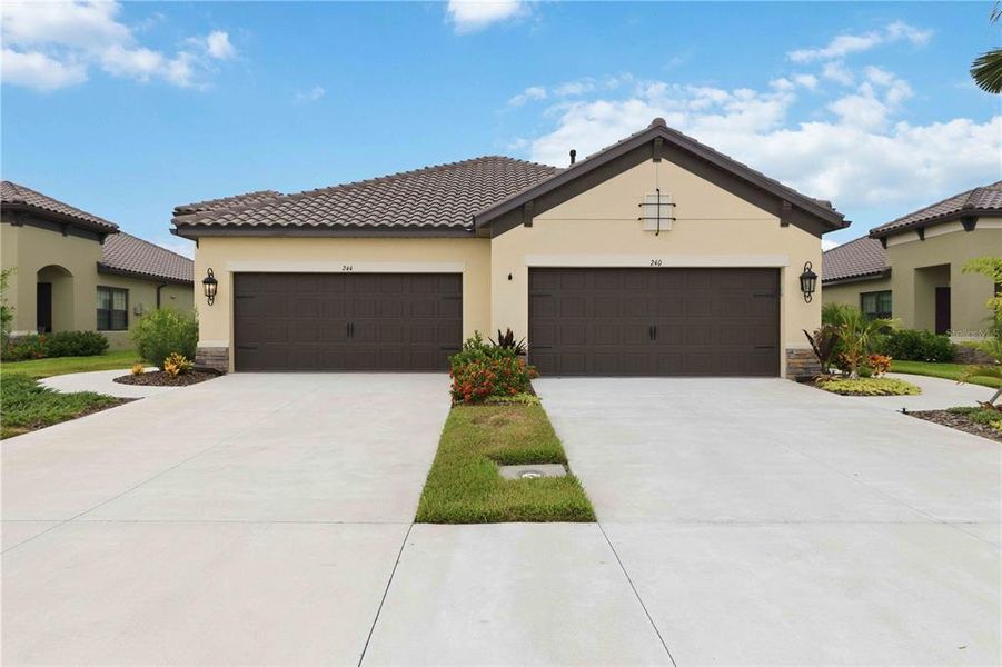 Front exterior of a new home in , Nokomis, FL, highlighting curb appeal (Image 22). Front exterior of a new home in , Nokomis, FL, highlighting curb appeal (Image 22).