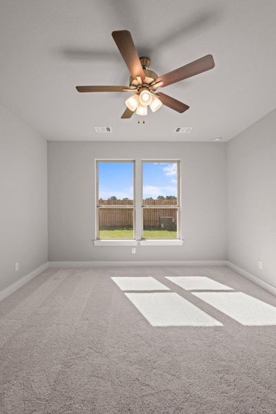 As you enter the primary bedroom, you’re greeted by an abundance of natural light pouring in through large, beautifully framed windows, casting a warm glow on the soft, neutral tones of the walls. As you enter the primary bedroom, you’re greeted by an abundance of natural light pouring in through large, beautifully framed windows, casting a warm glow on the soft, neutral tones of the walls.