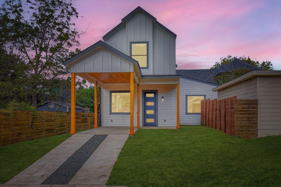 View of front facade featuring board and batten siding and covered porch View of front facade featuring board and batten siding and covered porch