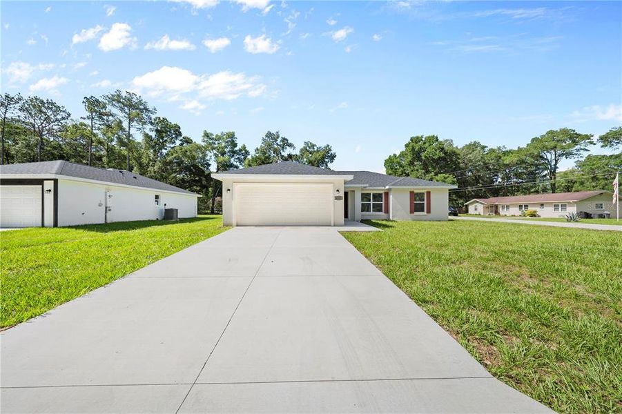 Front exterior of a new home in , Ocala, FL, highlighting curb appeal (Image 22).