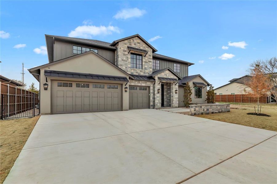 Craftsman house with driveway, an attached garage, board and batten siding, and a standing seam roof Craftsman house with driveway, an attached garage, board and batten siding, and a standing seam roof