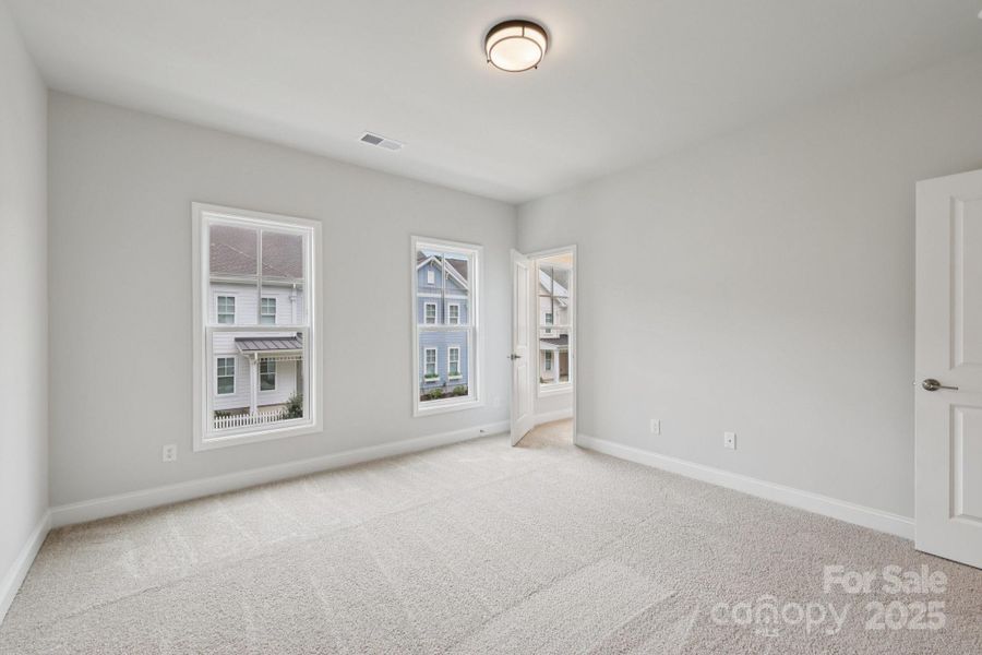 Spacious, unfurnished interior of a new home in Walk23, Huntersville (Image 29).