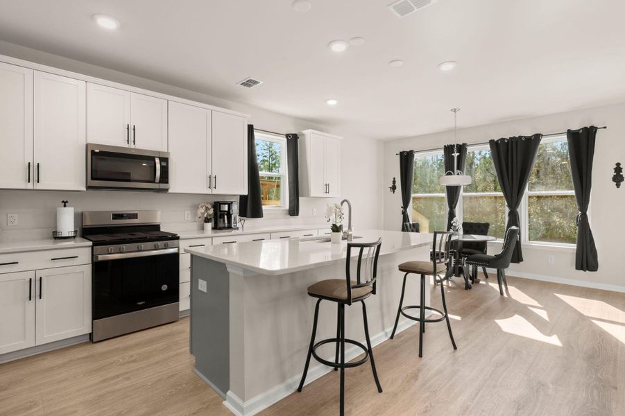 Furnished interior view inside a new home in Jasmine Point at Lakes of Cane Bay, Summerville (Image 9).